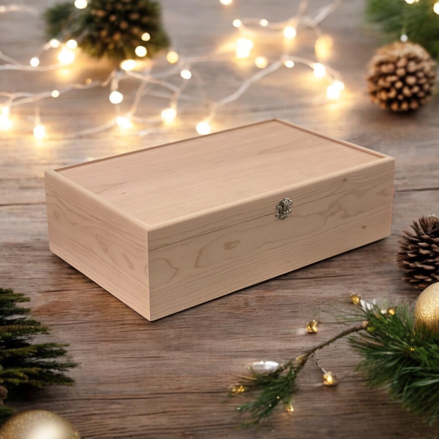 Wooden box on a wooden surface with Christmas decorations and lights.